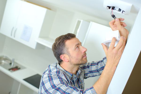 checking smoke detector