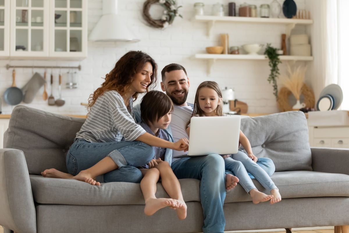 family on couch shutterstock_1660546246